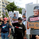 People attend a protest rally in Berlin, Germany, Saturday, Aug. 29, 2020.